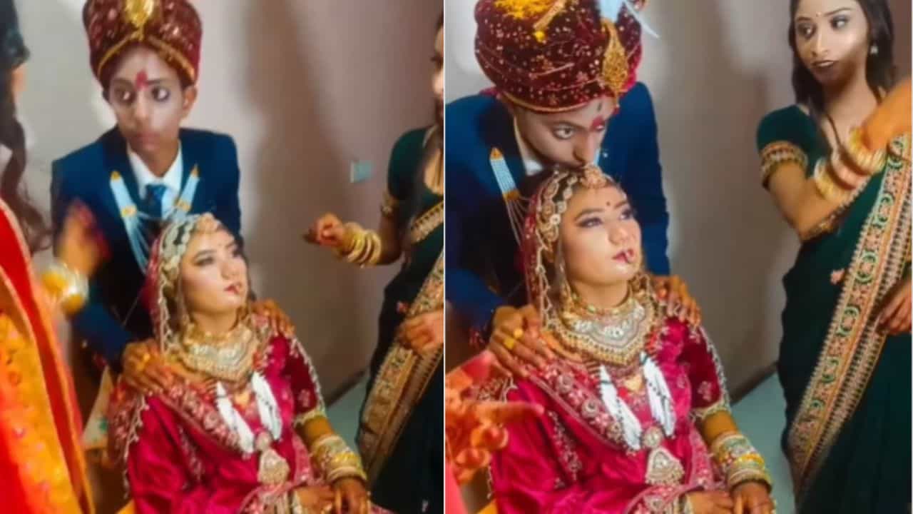 Funny Video: ਵਿਆਹ ਦੇ ਫੋਟੋਸ਼ੂਟ ਦੌਰਾਨ Kissing ਪੋਜ਼ ਲਈ ਲਾੜੇ ਨੂੰ ਲੈਣੀ ਪਈ ਟ੍ਰੇਨਿੰਗ