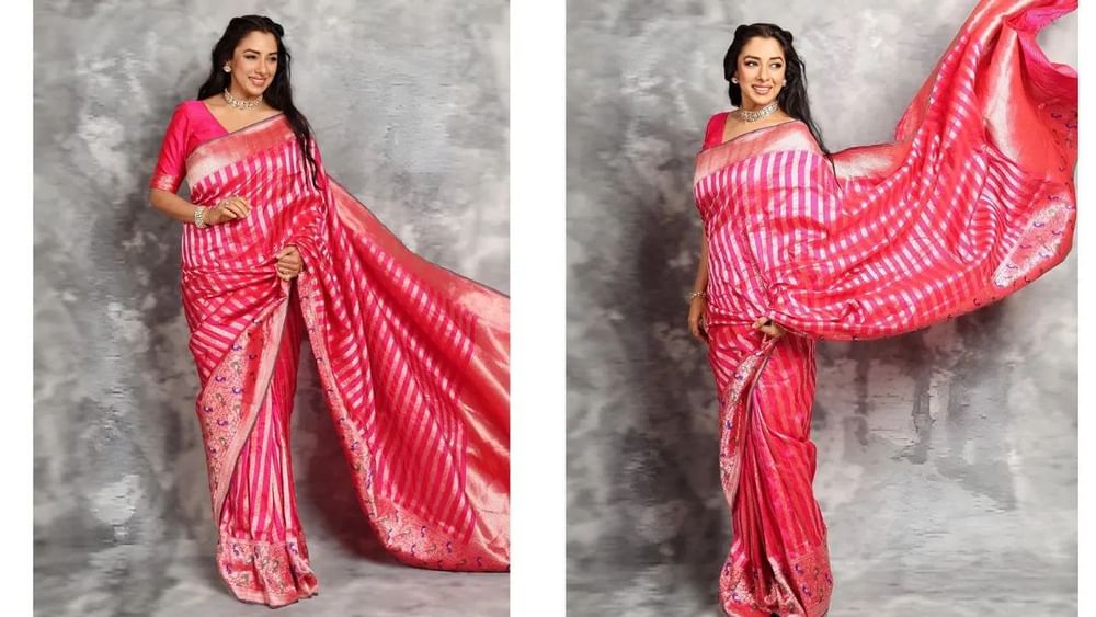 ਬਨਾਰਸੀ ਸਾੜੀ ਹਰ ਮੌਕੇ 'ਤੇ ਇੱਕ ਅਮੀਰ ਦਿੱਖ ਦਿੰਦੀ ਹੈ। ਵਟ ਸਾਵਿਤਰੀ 'ਤੇ ਰੂਪਾਲੀ ਗਾਂਗੁਲੀ ਵਾਂਗ ਸਟ੍ਰਿਪ ਡਿਜ਼ਾਈਨ ਵਾਲੀ ਗੁਲਾਬੀ ਸਾੜੀ ਪਹਿਨੋ। ਇਸ ਸਾੜੀ ਵਿੱਚ ਅਦਾਕਾਰਾ ਬਹੁਤ ਸੋਹਣੀ ਲੱਗ ਰਹੀ ਹੈ। ਸਟ੍ਰਿਪ ਡਿਜ਼ਾਈਨ ਦੇ ਨਾਲ, ਉਸਦੀ ਸਾੜੀ 'ਤੇ ਫੁੱਲਾਂ ਅਤੇ ਪੱਤਿਆਂ ਦੇ ਡਿਜ਼ਾਈਨ ਦਾ ਭਾਰੀ ਬਾਰਡਰ ਵੀ ਹੈ। ਜੋ ਸਾੜੀ ਨੂੰ ਹੋਰ ਵੀ ਸੁੰਦਰ ਦਿੱਖ ਦੇ ਰਿਹਾ ਹੈ।